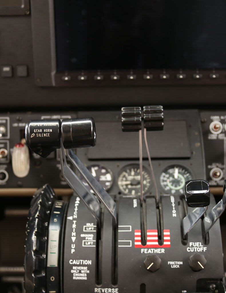 Close up controls in a small airplane cock pit.